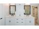 Bathroom with a double sink vanity, white cabinets, and black hardware at 2235 Birchtree Way, Marietta, GA 30062