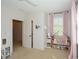 Bright bedroom with an open door, play area, and window at 2235 Birchtree Way, Marietta, GA 30062