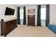 Cozy bedroom featuring dark wood furniture, light-colored walls, and large windows for ample natural light at 2235 Birchtree Way, Marietta, GA 30062