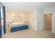 Bright and spacious bedroom with a plush bed, blue curtains, and ample closet space at 2235 Birchtree Way, Marietta, GA 30062