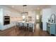 Spacious kitchen with white cabinets, stainless steel appliances, and a large center island with seating at 2235 Birchtree Way, Marietta, GA 30062