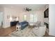 Comfortable living area with a plush sofa, accent chairs, and a stylish rug, complemented by a marble fireplace at 2235 Birchtree Way, Marietta, GA 30062