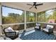 Relaxing screened porch with comfortable seating and scenic views of the surrounding trees at 2235 Birchtree Way, Marietta, GA 30062