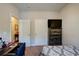 Bedroom with a bed, dresser, desk and neutral-toned walls and carpet at 504 Cole Creek Dr, Dallas, GA 30157