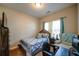 Bedroom with a bed, chair, dresser, desk and neutral-toned walls and carpet at 504 Cole Creek Dr, Dallas, GA 30157