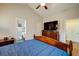 Bedroom featuring a large bed, dresser, and ensuite bathroom at 504 Cole Creek Dr, Dallas, GA 30157
