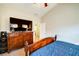 Bedroom featuring a large bed, dresser, and neutral carpet at 504 Cole Creek Dr, Dallas, GA 30157