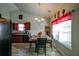 Cozy dining area featuring a chandelier, large window, and modern decor at 504 Cole Creek Dr, Dallas, GA 30157