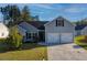 Charming home boasts a two-car garage and well-manicured lawn at 504 Cole Creek Dr, Dallas, GA 30157