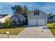 Charming home with a two-car garage, well-maintained lawn, and lovely curb appeal at 504 Cole Creek Dr, Dallas, GA 30157