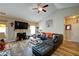 Cozy living room with fireplace, hardwood floors, and comfortable sectional sofa at 504 Cole Creek Dr, Dallas, GA 30157