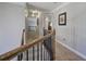 Upstairs hallway showcasing the carpet and paint and the access to multiple bedrooms at 5327 Saville Nw Dr, Acworth, GA 30101