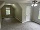 Bedroom with a window, ceiling fan, closet, and neutral carpeting at 5755 Belmont Ridge Cir, Lithonia, GA 30038