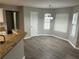 Cozy dining area with hardwood floors, bright windows, and a modern chandelier at 5755 Belmont Ridge Cir, Lithonia, GA 30038