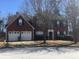 Charming two-story home with a well-maintained lawn and mature trees, offering great curb appeal at 5755 Belmont Ridge Cir, Lithonia, GA 30038