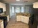 Modern kitchen with granite countertops, stainless steel appliances, and ample cabinet space at 5755 Belmont Ridge Cir, Lithonia, GA 30038