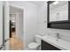 Bright bathroom with a modern vanity, clean fixtures, and a door into an adjoining room at 209 14Th Ne St # 109, Atlanta, GA 30309