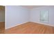 Bedroom with hardwood floors, light gray walls, window with blinds, and white trim at 209 14Th Ne St # 109, Atlanta, GA 30309