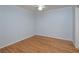 Cozy bedroom with light blue walls, white ceiling fan and beautiful hardwood flooring at 209 14Th Ne St # 109, Atlanta, GA 30309