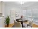 Bright breakfast nook with a round table, comfortable seating, and natural light from large windows at 209 14Th Ne St # 109, Atlanta, GA 30309