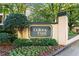 Community sign 'Colony Park CitiHomes' is framed by greenery and provides a sense of exclusivity at 209 14Th Ne St # 109, Atlanta, GA 30309