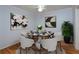 Elegant dining room featuring a modern glass table, stylish chairs, and sophisticated decor at 209 14Th Ne St # 109, Atlanta, GA 30309