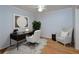 Bright home office with hardwood floors, stylish decor, comfortable seating, and modern desk space at 209 14Th Ne St # 109, Atlanta, GA 30309