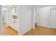 Compact kitchen area with white cabinets, stone backsplash and stainless dishwasher at 209 14Th Ne St # 109, Atlanta, GA 30309