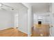 Open-concept living room featuring neutral paint, wood flooring, fireplace, and large windows at 209 14Th Ne St # 109, Atlanta, GA 30309
