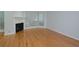 Large living room with fireplace, bright natural light, and hardwood floors at 209 14Th Ne St # 109, Atlanta, GA 30309