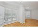 Bright living room features large windows with hardwood floors and neutral paint at 209 14Th Ne St # 109, Atlanta, GA 30309