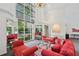 Bright and spacious lobby with soaring ceilings, large windows, and elegant decor at 209 14Th Ne St # 109, Atlanta, GA 30309