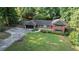 Aerial view of home, with mature trees, large lot and attached garage at 23 Hunting Creek Dr, Marietta, GA 30068