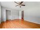 Bedroom featuring hardwood floors, neutral walls, ceiling fan, and closet at 23 Hunting Creek Dr, Marietta, GA 30068