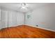 Bedroom with hardwood floors, ceiling fan, and ample closet space at 23 Hunting Creek Dr, Marietta, GA 30068