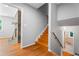 Inviting entryway with hardwood floors, fireplace and stairway leading to the upper level and an entry to a lower level bath at 23 Hunting Creek Dr, Marietta, GA 30068