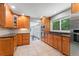 Open kitchen with stainless steel appliances, custom wood cabinets, and seamless access to dining area at 23 Hunting Creek Dr, Marietta, GA 30068