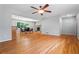 Inviting living room with hardwood floors adjacent to the dining area with fireplace at 23 Hunting Creek Dr, Marietta, GA 30068