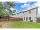 Great backyard with a well maintained green lawn, a concrete patio, and a wooden fence to provide privacy at 2500 Morgan Chase Dr, Buford, GA 30519