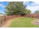 Spacious backyard with a beautiful lawn and tall wooden fence for added privacy and seclusion at 2500 Morgan Chase Dr, Buford, GA 30519