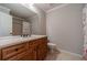 Bathroom vanity with mirror, toilet, and shower with curtain at 2500 Morgan Chase Dr, Buford, GA 30519