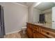 Bathroom with vanity, mirror, granite countertop, and shower at 2500 Morgan Chase Dr, Buford, GA 30519