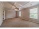 Large bedroom featuring neutral walls, carpet, and bright natural light at 2500 Morgan Chase Dr, Buford, GA 30519