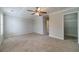 Bedroom with neutral walls, carpet, ceiling fan and walk-in closet at 2500 Morgan Chase Dr, Buford, GA 30519