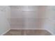 Walk-in closet featuring carpet and white shelving at 2500 Morgan Chase Dr, Buford, GA 30519