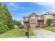 Charming brick townhome featuring a one-car garage, landscaped yard, and a classic architectural design at 2500 Morgan Chase Dr, Buford, GA 30519