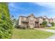 Brick townhome with an attached one-car garage and manicured lawn at 2500 Morgan Chase Dr, Buford, GA 30519