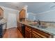 Kitchen features granite counters, wood cabinets, and stainless sink at 2500 Morgan Chase Dr, Buford, GA 30519