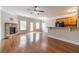 Open living room with fireplace, hardwood floors and natural light at 2500 Morgan Chase Dr, Buford, GA 30519
