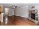 Spacious living room with hardwood floors and stone fireplace at 2500 Morgan Chase Dr, Buford, GA 30519